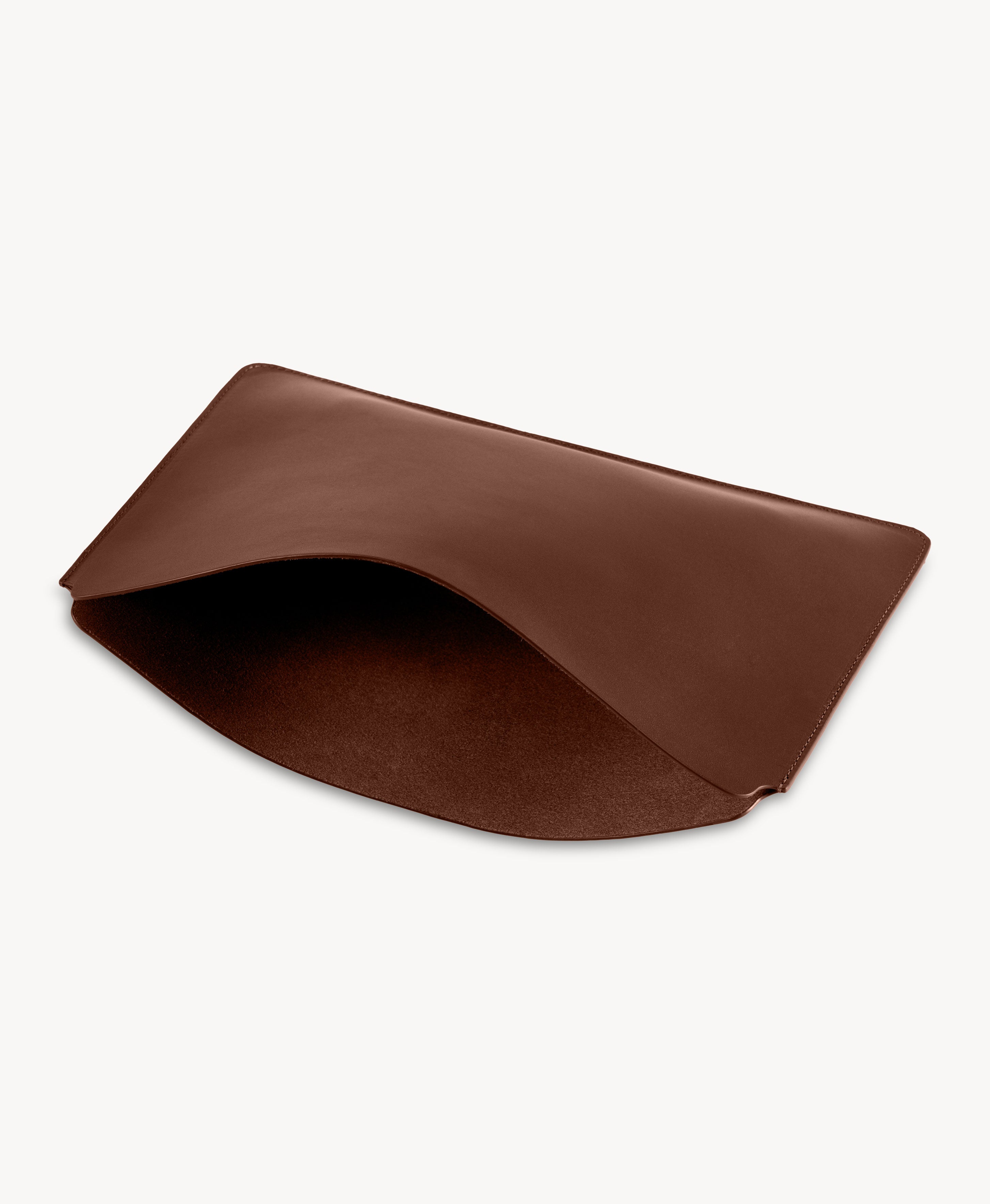 Brown full grain saddle leather laptop sleeve, open top and interior view