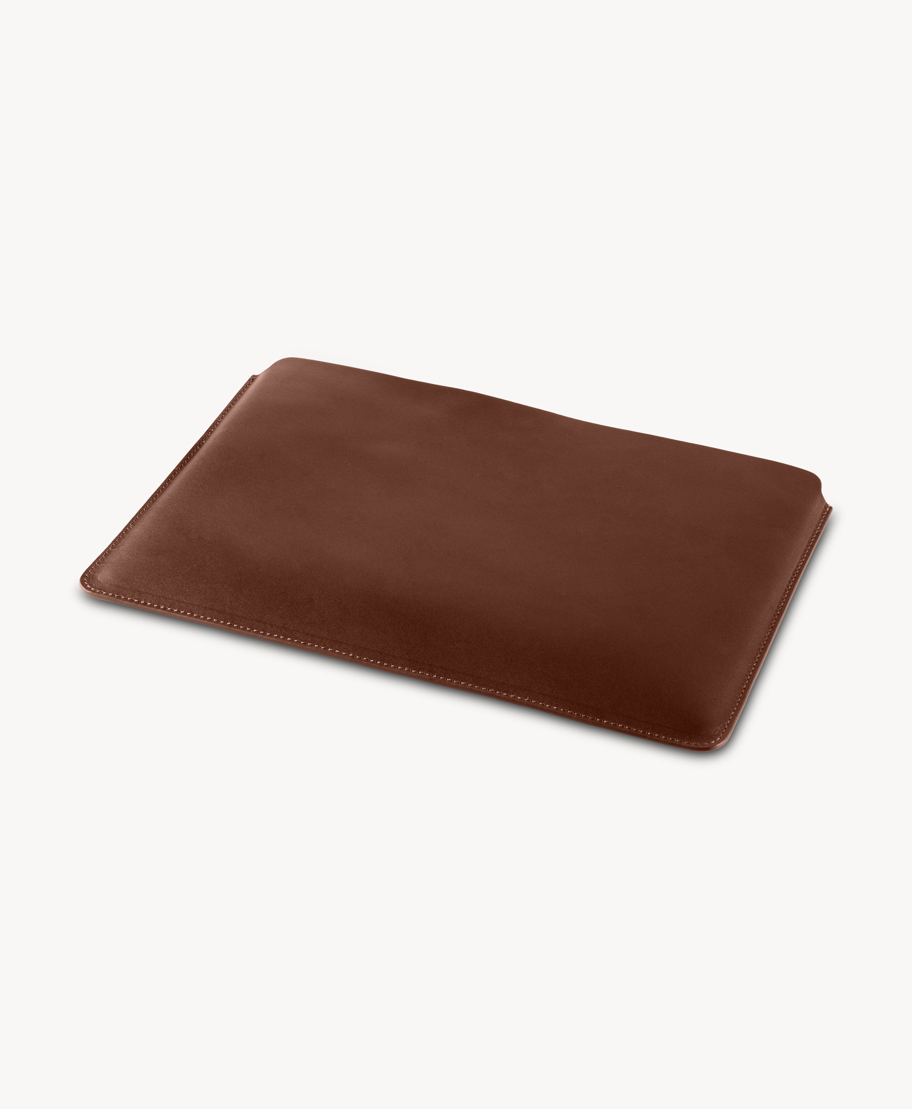 Brown full grain saddle leather laptop sleeve, angled product view