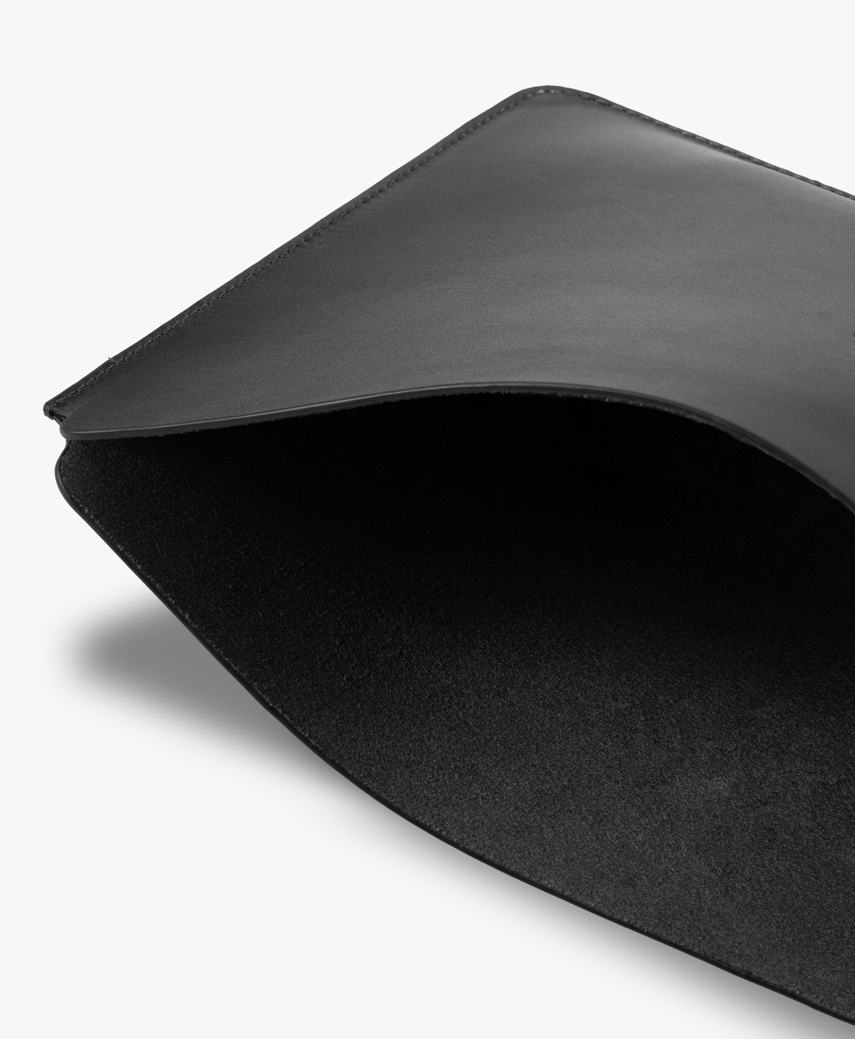 Black full grain saddle leather laptop sleeve, interior close-up