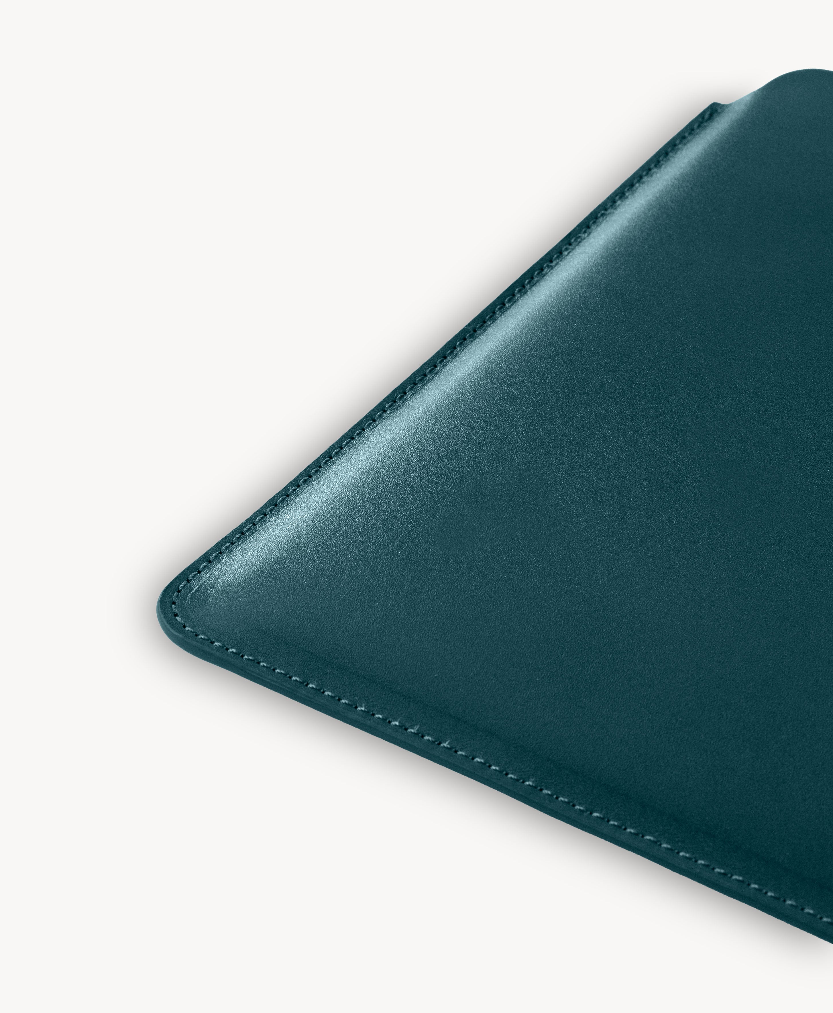 Blue full grain saddle leather laptop sleeve, stitched edge detail