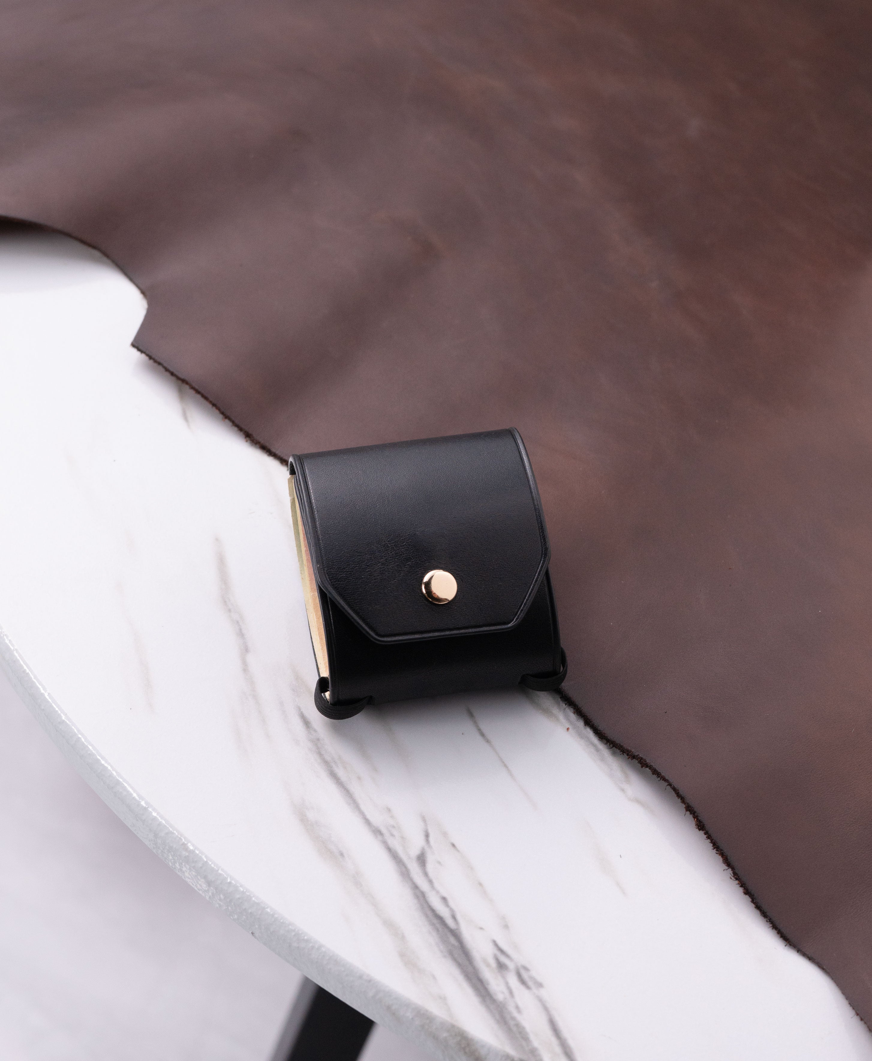 Black full-grain saddle leather cash wrap wallet lifestyle view 1