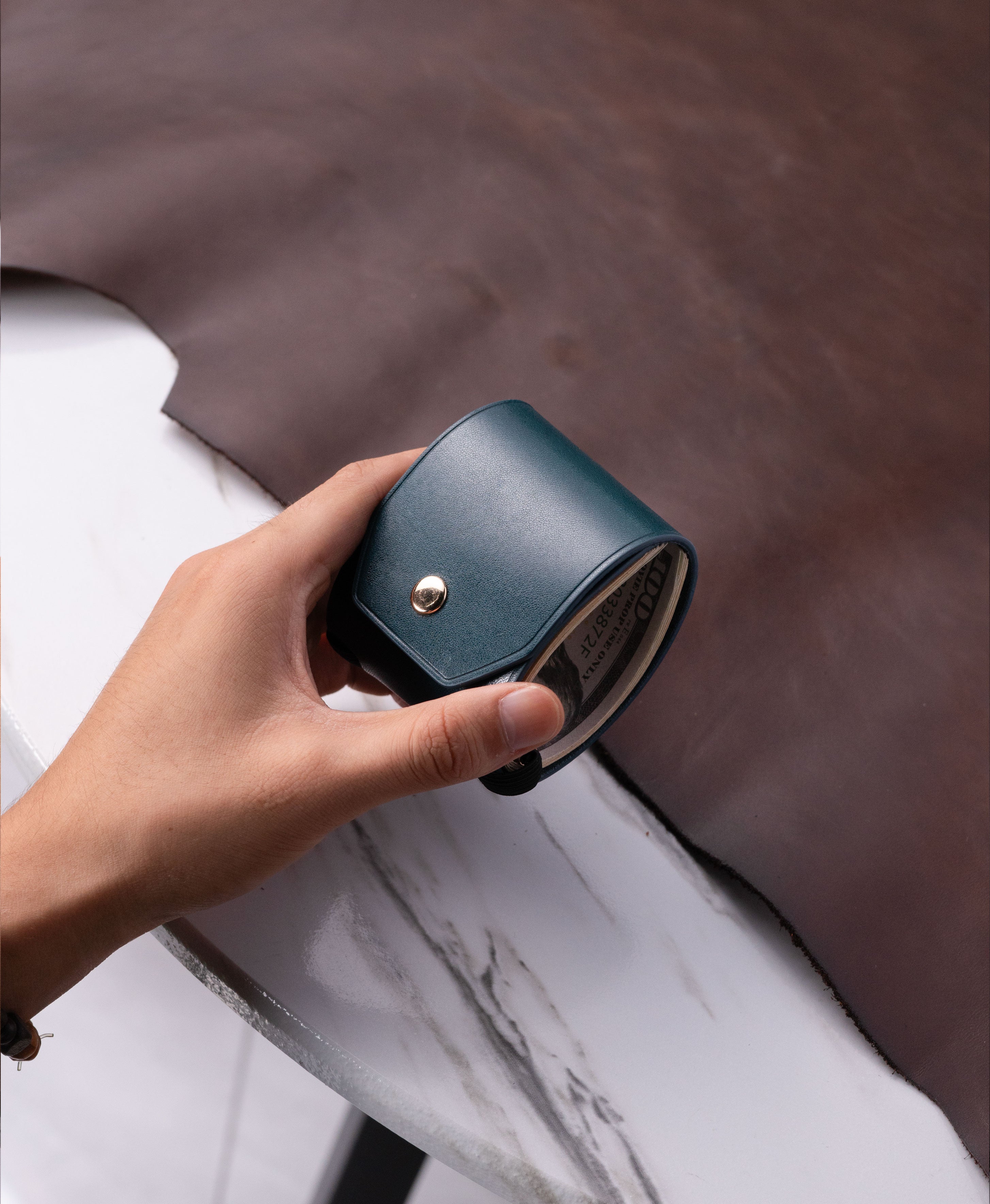 Blue full-grain saddle leather cash wrap wallet lifestyle view 2