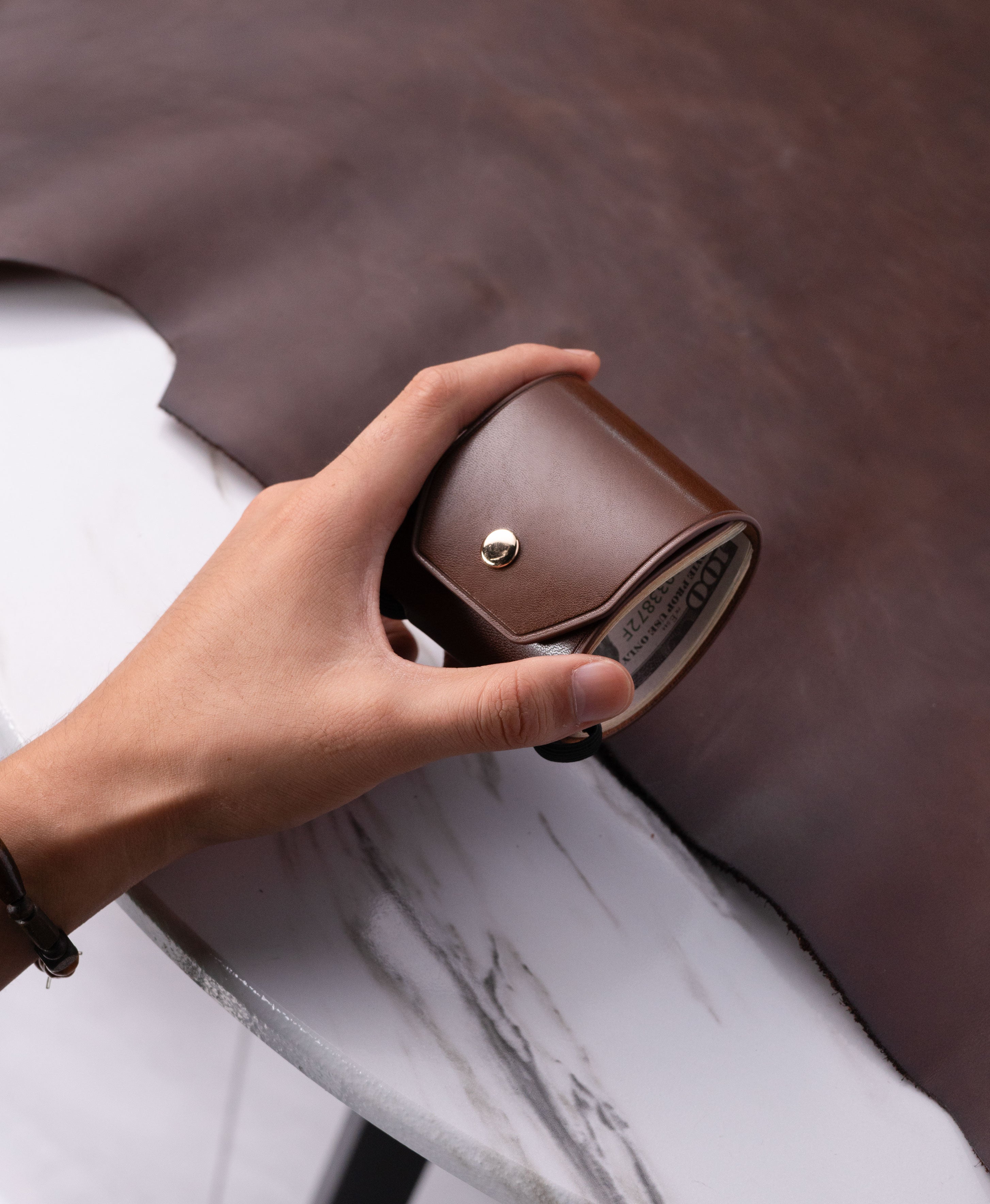 Brown full-grain saddle leather cash wrap wallet lifestyle view 3