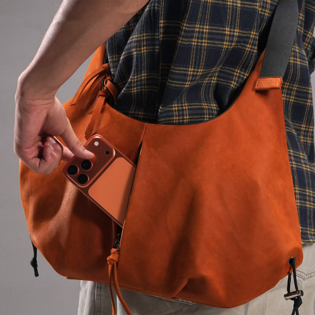 KAKAVY Orange Multi-Zip Crossbody Bag — Phone access from the front zip pocket